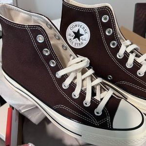 BRAND NEW! NEVER WORN! Chuck Taylor Converse High Top 8.5 Men’s/10.5 Women’s.